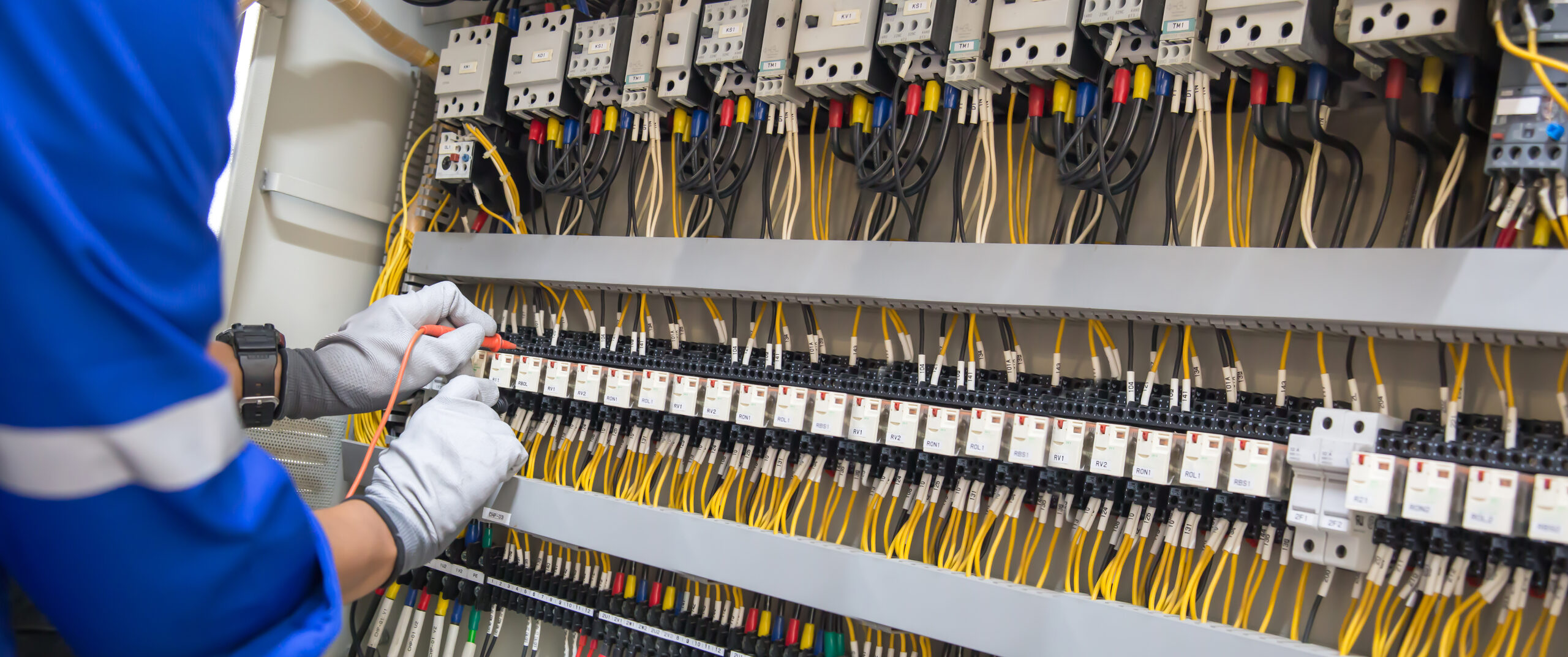 Closeup Hand Electrical Engineering Using Measuring Checking Electricity Scaled